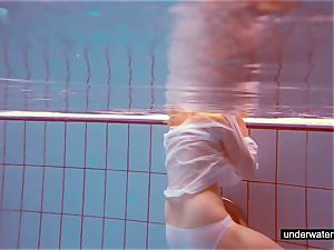 super-cute ginger-haired plays bare underwater